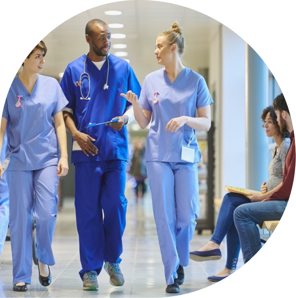 Doctor and nurses walking down a corridor